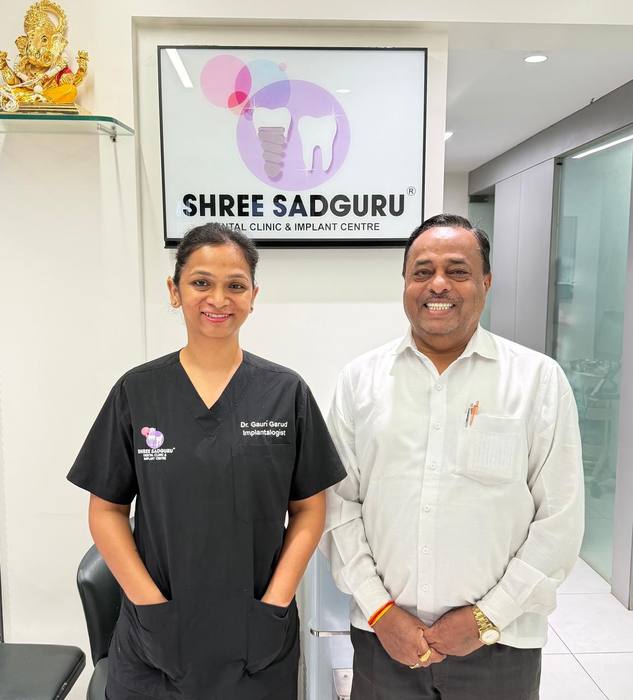 Dr. Gauri Garud, Implantologist, with a happy patient